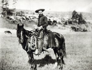 Cowboy som rir på en hest i Montana, USA, ca. 1880